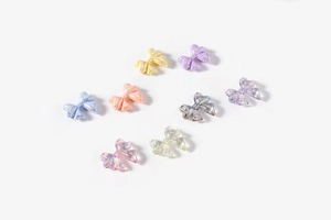 Macro view of transparent aurora bow beads with shimmering 3D finish for DIY crafts