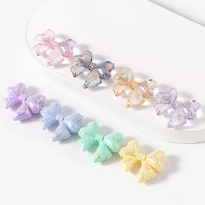 Iridescent 3D bow-shaped resin beads in pastel candy colors for DIY jewelry making