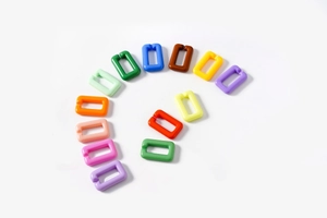 Macro detail of multicolored acrylic rectangle chain links for DIY accessory design