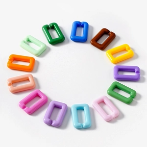 Colorful acrylic U-shaped chain links in various glossy colors arranged in a circle