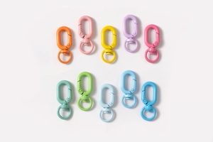 Close-up of colorful swivel lobster clasps in ten vibrant painted alloy finishes