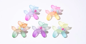 Detailed set of five gradient frosted balloon dog charms with beaded collars for DIY crafts