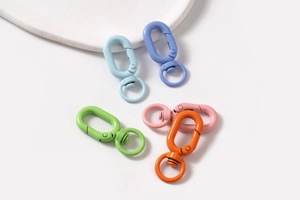 Close-up of assorted macaron-colored alloy spring ring clasps for DIY jewelry making