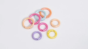 Macro detail of colorful pearlescent round spring gate rings in various macaron colors