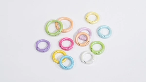 Macro view of macaron colored spring O-rings showing pearl finish and snap clip detail