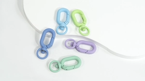 Macro detail of matte colorful oval spring rings and swivel clips for DIY crafts