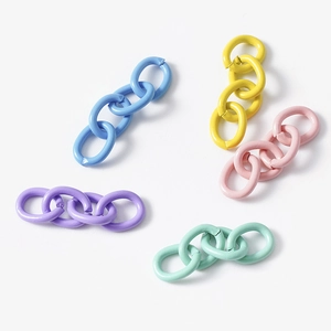 Colorful macaron DIY chain link connectors for jewelry and keychains on a grey background