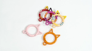 Detailed view of cat-ear spring hooks in five colors for DIY keychain making