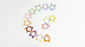 Flat lay of colorful cat-shaped spring ring lobster clasps for DIY jewelry making