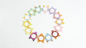 Flat lay of colorful cat-shaped spring ring buckles in various painted metal finishes