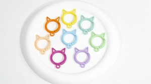 Detailed top view of 8 colorful cat-shaped spring ring clasps in macaron shades