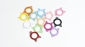 Close-up of cat-ear shaped alloy spring ring keychains in various colorful paint finishes