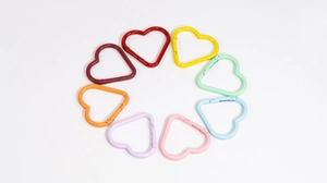 Colorful heart-shaped carabiners in nine assorted vibrant and pastel painted metal finishes