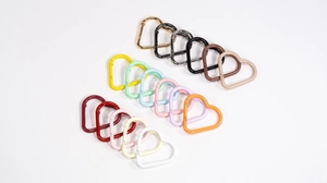Detailed set of 15 colorful heart-shaped carabiners in matte and metallic alloy finishes
