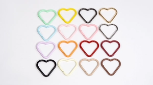 Matrix display of 16 colorful heart-shaped carabiners with side spring gate design