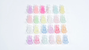 Assorted colorful acrylic bunny beads in matte and glitter finishes for DIY jewelry making