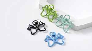 Detail of colorful butterfly metal lobster clasps for DIY keychains in four pastel shades
