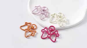 Close-up of colorful bow-shaped metal spring hooks with 360-degree rotating rings