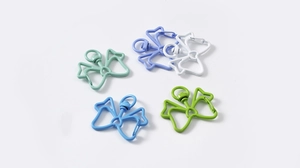Close-up of butterfly shaped metal lobster clasps in five vibrant colors for DIY crafts