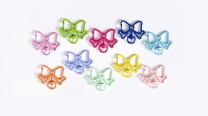 Close-up of ten colorful butterfly-shaped keychains with swivel bases and spring clasps