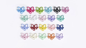 Flat lay of colorful butterfly-shaped metal clasps for DIY keychains and jewelry making