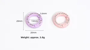 Detail of pink and purple 20mm round spring rings with inlaid rhinestones for accessories
