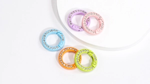 Close-up of colorful rhinestone spring ring buckles for keychains and bag accessories