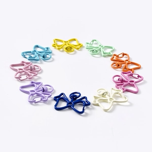 Colorful butterfly shaped metal lobster clasps and keychains in a circular arrangement