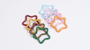 Macro shot of colorful star-shaped spring buckles in eight different candy colors