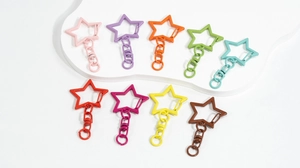 Detailed view of colorful star-shaped alloy lobster clasps with matte finish rings