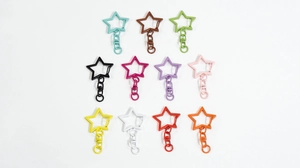 Set of 11 colorful star-shaped alloy keychains with rotating swivel hooks and jump rings