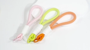 Detailed macro view of woven macaron cords with sturdy metal carabiners and white wrapping