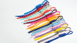 Close-up of colorful braided handmade lanyard cords with secure loop attachments