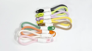 Detail view of colorful hand-woven nylon lanyard keychains with matching metal O-rings