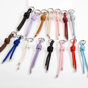 Handcrafted colorful braided leather keychains with silver rings and cord knot charms