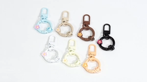 Close-up of colorful flower spring ring buckles and floral DIY connector accessories