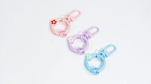 Pastel flower spring ring keychains in pink, purple, and blue colors for DIY projects