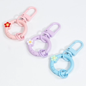 Floral spring ring keychains set in macaron pink, purple, and blue matte metal