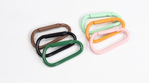 Detailed view of colorful D-shaped aluminum carabiners with spring snap clips in six vibrant colors