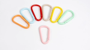 Detailed view of colorful D-shaped carabiner clips with matte finish in various vibrant tones