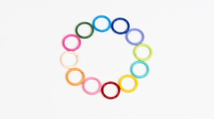 Close-up of 10mm colorful lacquered iron jump rings for DIY jewelry and crafts