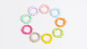 Detailed view of colorful octagonal spring rings with bow design for DIY crafts