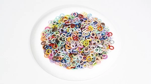 Macro shot of colorful 10mm jump rings in assorted paint finishes for DIY jewelry making