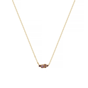 Detailed close-up of 18k gold-plated O-chain necklace featuring five purple gemstones