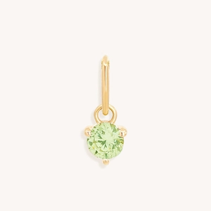 Macro-opname van 18k vergulde hanger met een ronde groene zirkonia steen