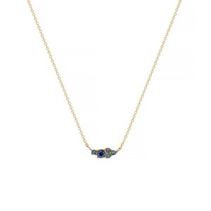 Close-up of titanium steel gold chain necklace featuring five blue gemstones in a row