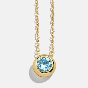 Classic 18K gold O-chain necklace featuring a round light blue zircon bezel pendant