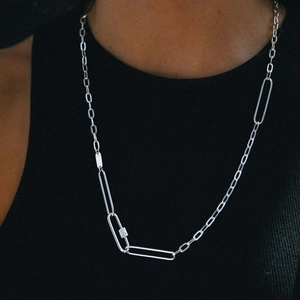 Detailed close-up of 925 sterling silver stamp on a chunky mixed-link necklace
