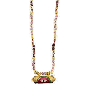 Detailed shot of evil eye pendant with multicolored beads on vintage gold necklace