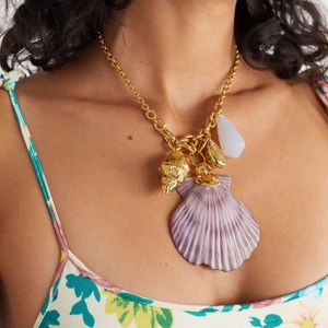 Golden chain necklace with large purple shell and conch pendant for summer beach style